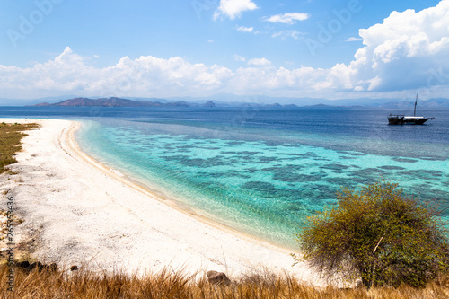 Crystal clear water in Sabolon Besar island, one of the many island paradise spots for diving in the protected area of Komodo National Park, Lubuan Bajo, Nusa Tenggara, Flores, Indonesia photo