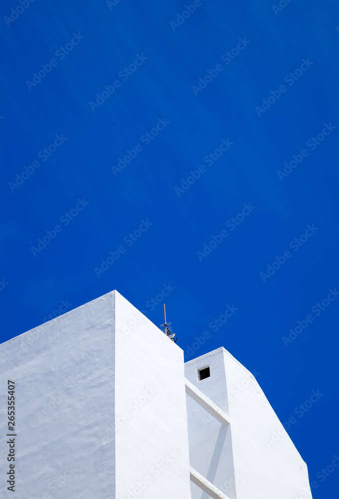 white building against blue sky white building against blue sky