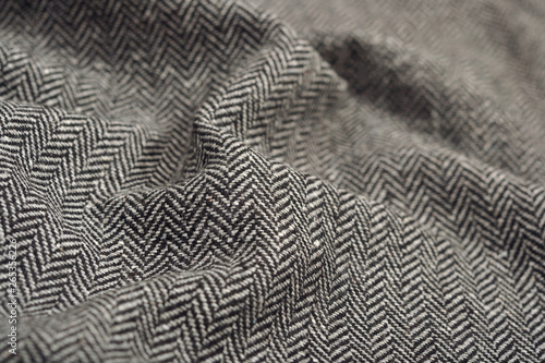 Draped herringbone tweed wool fabric texture
