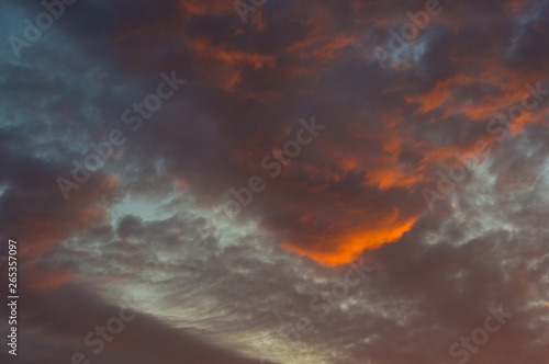 Landscape with dramatic light - beautiful golden sunset with saturated sky and clouds, peaceful nature serene background.