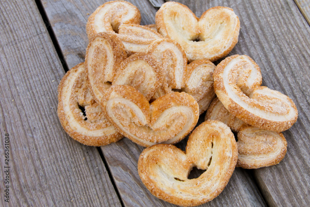 Palmier cookies on wooden table Palmier cookies on wooden table