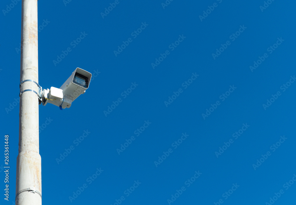security video camera on blue sky background security video camera on blue sky background