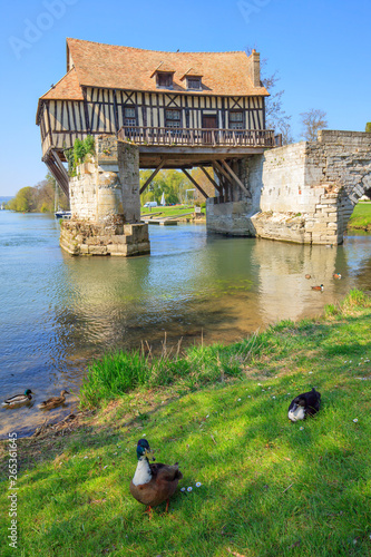 Old mill on bridge Seine river, Vernon, Normandy, France photo