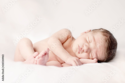 Newborn Baby Sleeping Peacefully on Soft Blanket