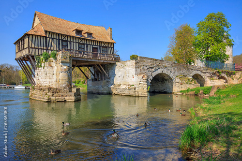 Old mill on bridge Seine river, Vernon, Normandy, France photo