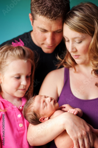 Family Holding Newborn Baby