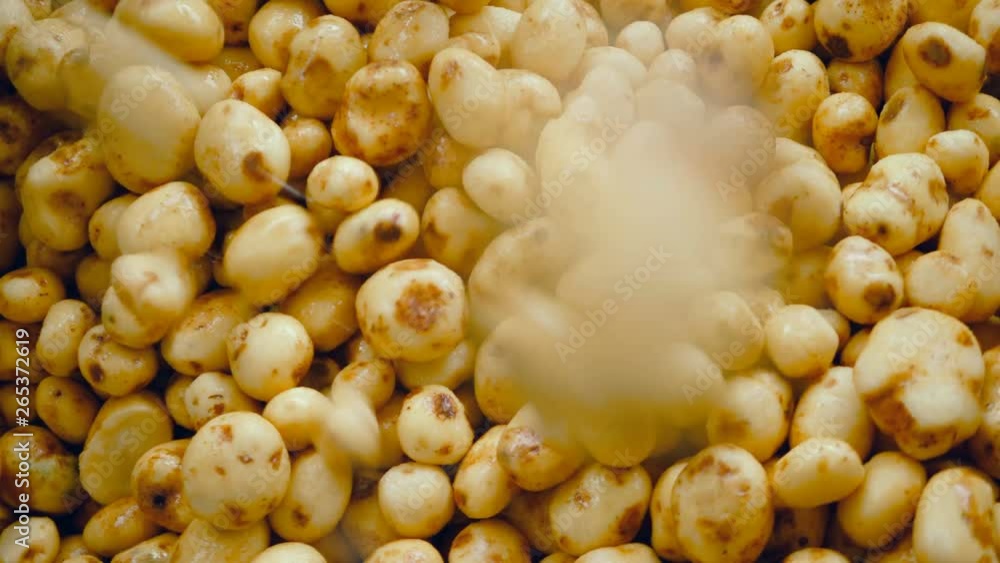 Cleaned tubers of potato are getting thrown onto each other Cleaned tubers of potato are getting thrown onto each other