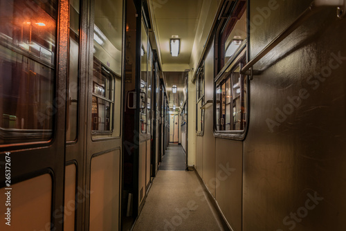 Dark night corridor with doors to compartments in czech train