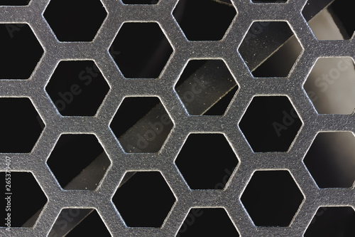 metal grid symmetrical macro / background photo dark shades
