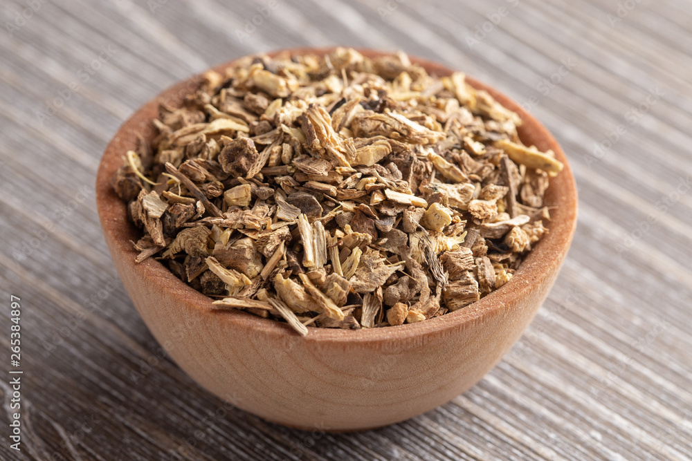 Echinacea Root in a Wooden Bowl on a Gray Wood Table Echinacea Root in a Wooden Bowl on a Gray Wood Table