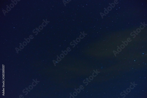 The night sky with stars and clouds. Natural background.