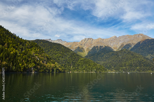 Landscape with mountains, forest and a lake in front