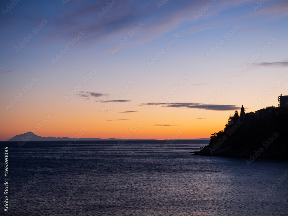 Sunset and island of Thassos on the horizon