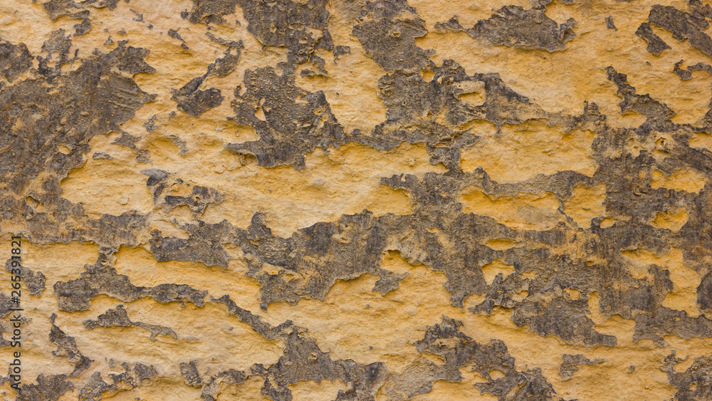 Background of the old wall. Texture of stone surface. Abstract background in retro style. Brown surface of solid material Background of the old wall. Texture of stone surface. Abstract background in retro style. Brown surface of solid material