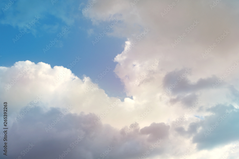 white, fluffy, cumulus clouds on a blue sky background, copy space