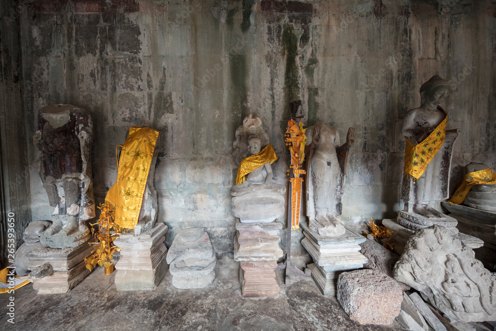 Fototapeta premium View inside Angkor Wat temple looking towards a Buddhist shrine, Siem Reap, Cambodia