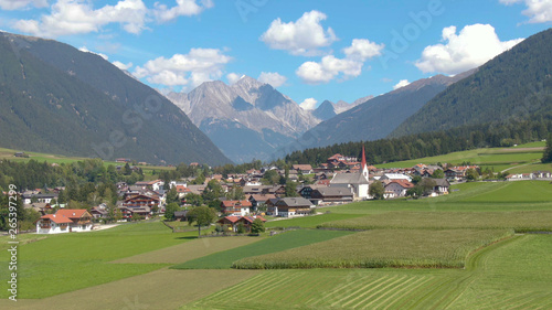 DRONE: Flying towards a scenic village in the picturesque Austrian countryside.