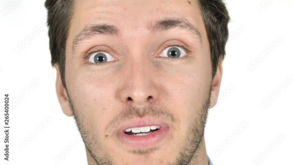 Close Up of Surprised Face of Young Man on White Background Close Up of Surprised Face of Young Man on White Background
