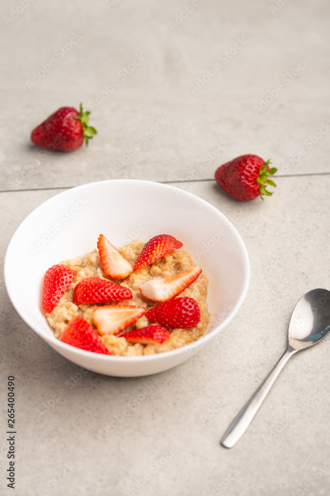 breakfast of oatmeal with strawberries, flat lay breakfast of oatmeal with strawberries, flat lay