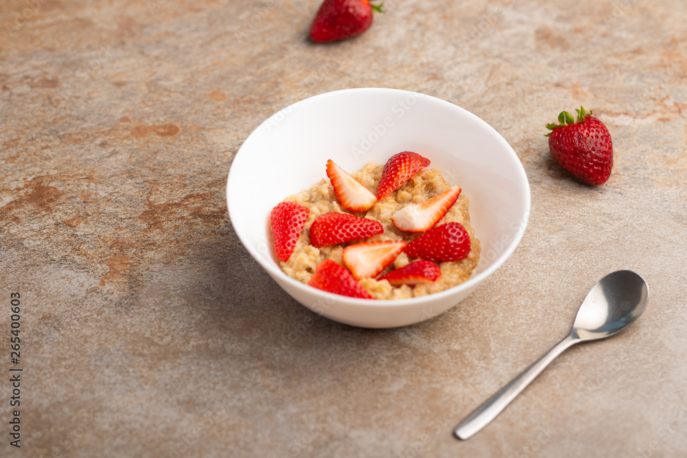 breakfast of oatmeal with strawberries, flat lay breakfast of oatmeal with strawberries, flat lay