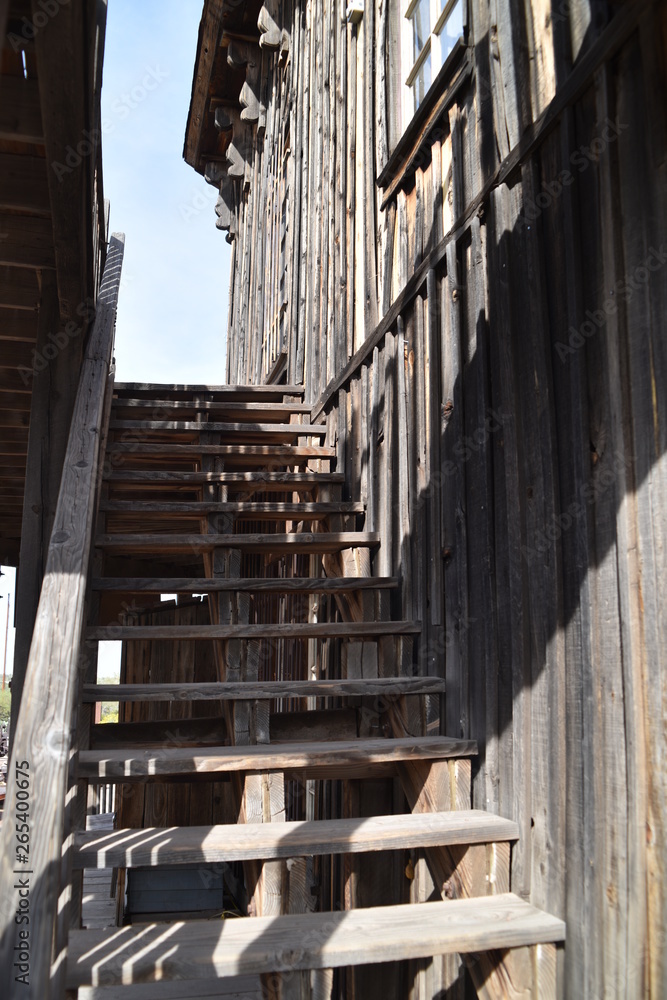 Arizona's Goldfield ghosttown: weathered buildings and furniture, wooden stairwells, rusted stove, and vintage wooden sidewalks Arizona's Goldfield ghosttown: weathered buildings and furniture, wooden stairwells, rusted stove, and vintage wooden sidewalks