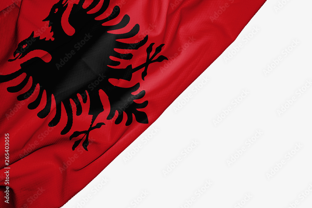 Albania flag of fabric with copyspace for your text on white background. Albania flag of fabric with copyspace for your text on white background.