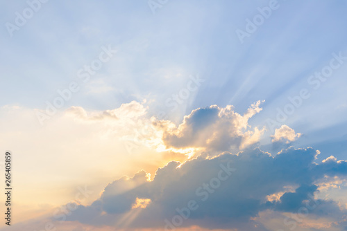 Beautiful dramatic sky clouds with light rays at sunset. Natural landscape for background