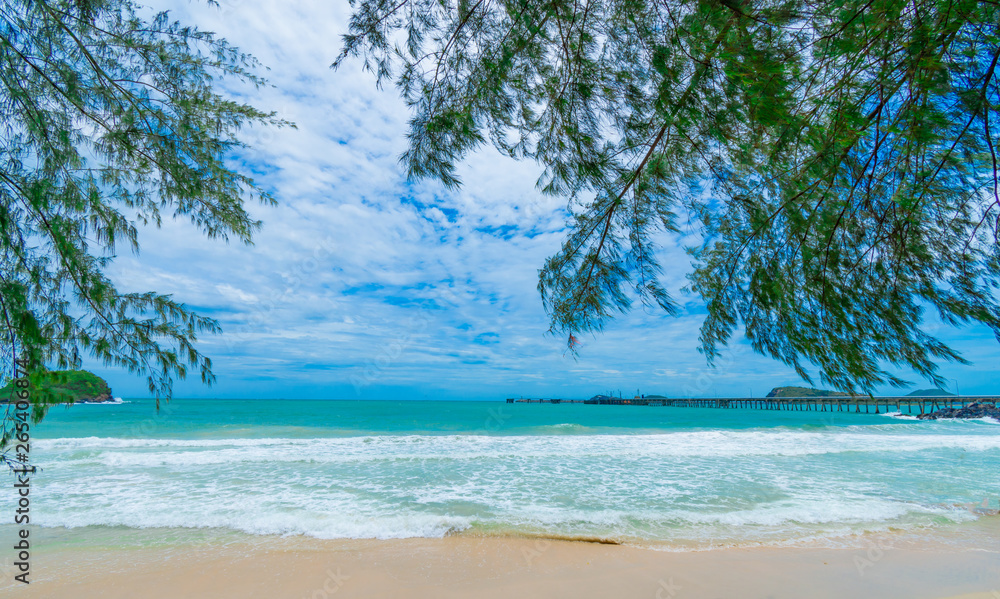 beach and tropical sea on blue sky background. beach and tropical sea on blue sky background.