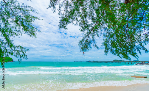 beach and tropical sea  on blue sky background. © stockchalathan