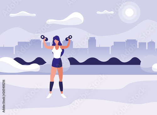 athletic woman weight lifting in the park