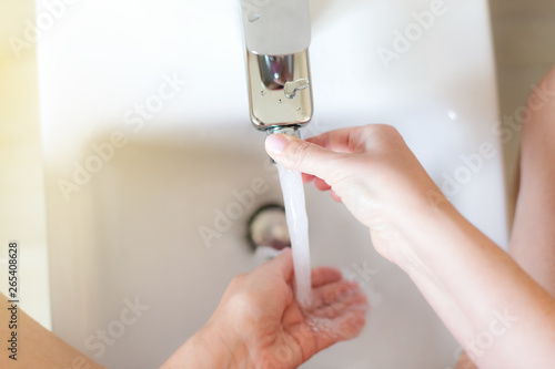 Woman taking hygiene shower with bidet