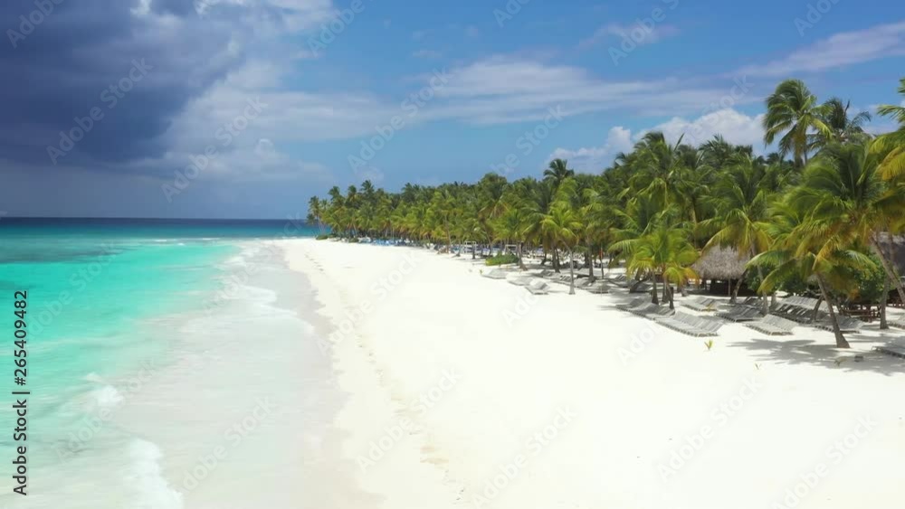 Aerial view from drone on tropical island with coconut palm trees and turquoise caribbean sea. Travel destination. Summer vacations. Saona Island. Dominican Republic Aerial view from drone on tropical island with coconut palm trees and turquoise caribbean sea. Travel destination. Summer vacations. Saona Island. Dominican Republic