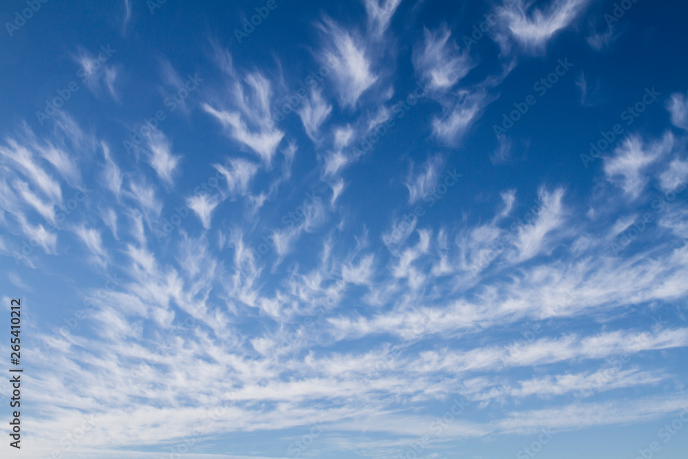sky background with white cirrus clouds; vibrant sky background with diminishing perspective