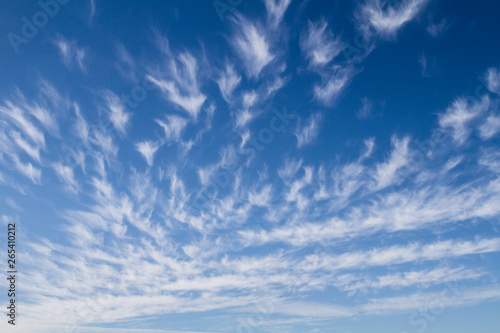 sky background with white cirrus clouds; vibrant sky background with diminishing perspective
