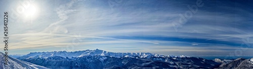 Panoramic view of the Caucasus mountains covered by snow in the ski resort of Krasnaya Polyana, Russia.