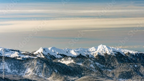 Awesome view of the Caucasus mountains covered by snow in the ski resort of Krasnaya Polyana, Russia.