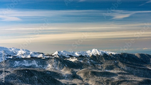 Awesome view of the Caucasus mountains covered by snow in the ski resort of Krasnaya Polyana, Russia.