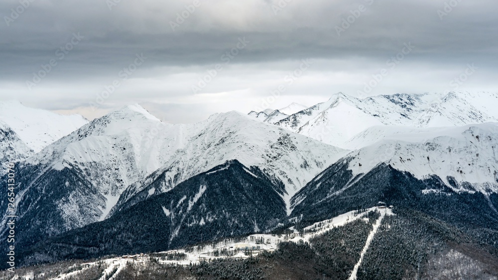 Obraz premium Awesome view of the Caucasus mountains covered by snow in the ski resort of Krasnaya Polyana, Russia.