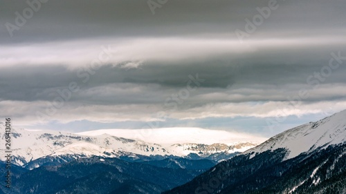 Awesome view of the Caucasus mountains covered by snow in the ski resort of Krasnaya Polyana, Russia. © Viacheslav