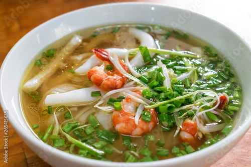 Classical Vietnamese soup pho with rice noodles and seafood with green onion tasty
