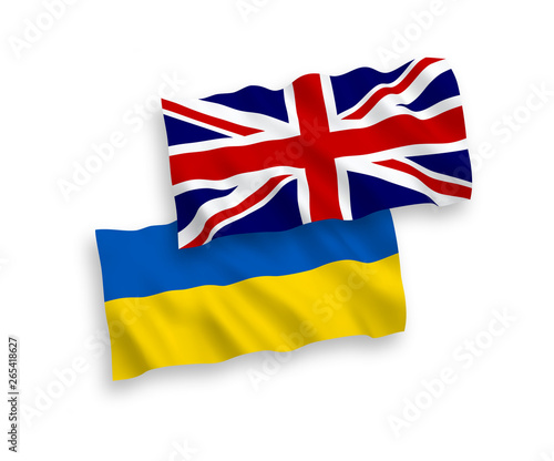 National vector fabric wave flags of Ukraine and Great Britain isolated on white background. 1 to 2 proportion.
