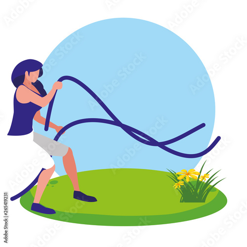 athletic woman practicing exercice with elastics bands in the camp