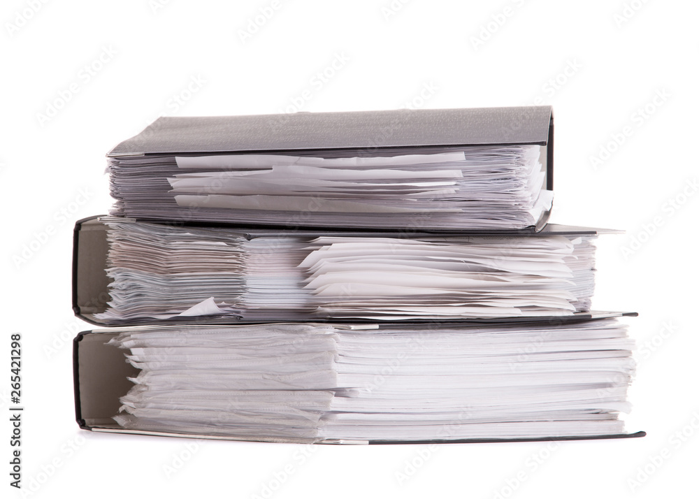A stack of office documents close-up. Folder with documents isolate on white background. A stack of office documents close-up. Folder with documents isolate on white background.