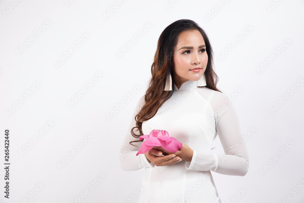 Vietnamese girl take photo with Vietnamese traditional clothes in studio Vietnamese girl take photo with Vietnamese traditional clothes in studio