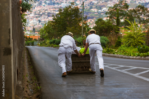 Obraz na plátně Toboggan riders on sledge in Monte - Funchal Madeira Portugal