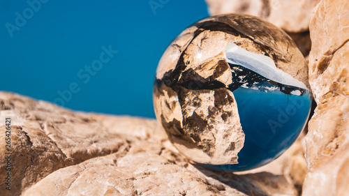 Crystal ball alpine winter landscape shot at the Buchensteinwand-Tyrol-Austria photo