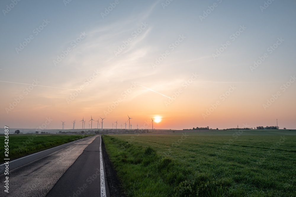 sunrise at a windpark in germany
