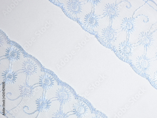 Blue lace on diagonal on a white background photo