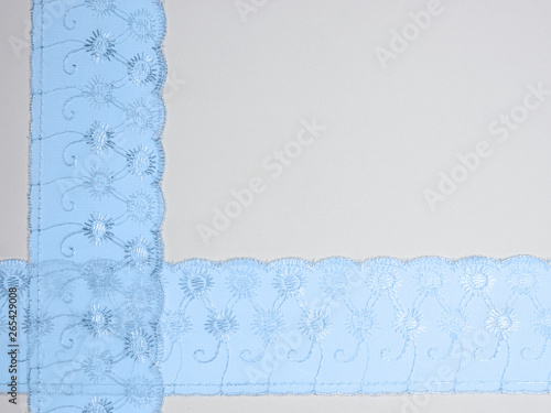 Blue lace on a white background photo