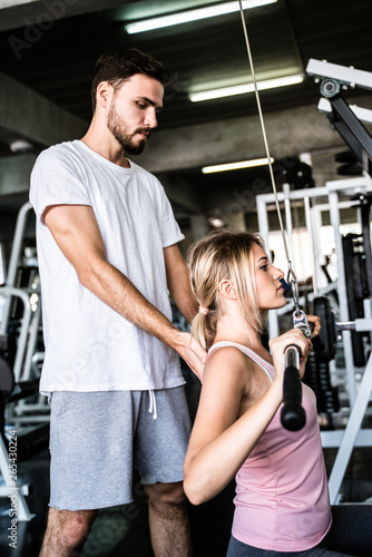 Healthy lifestyle couple working out in fitness gym